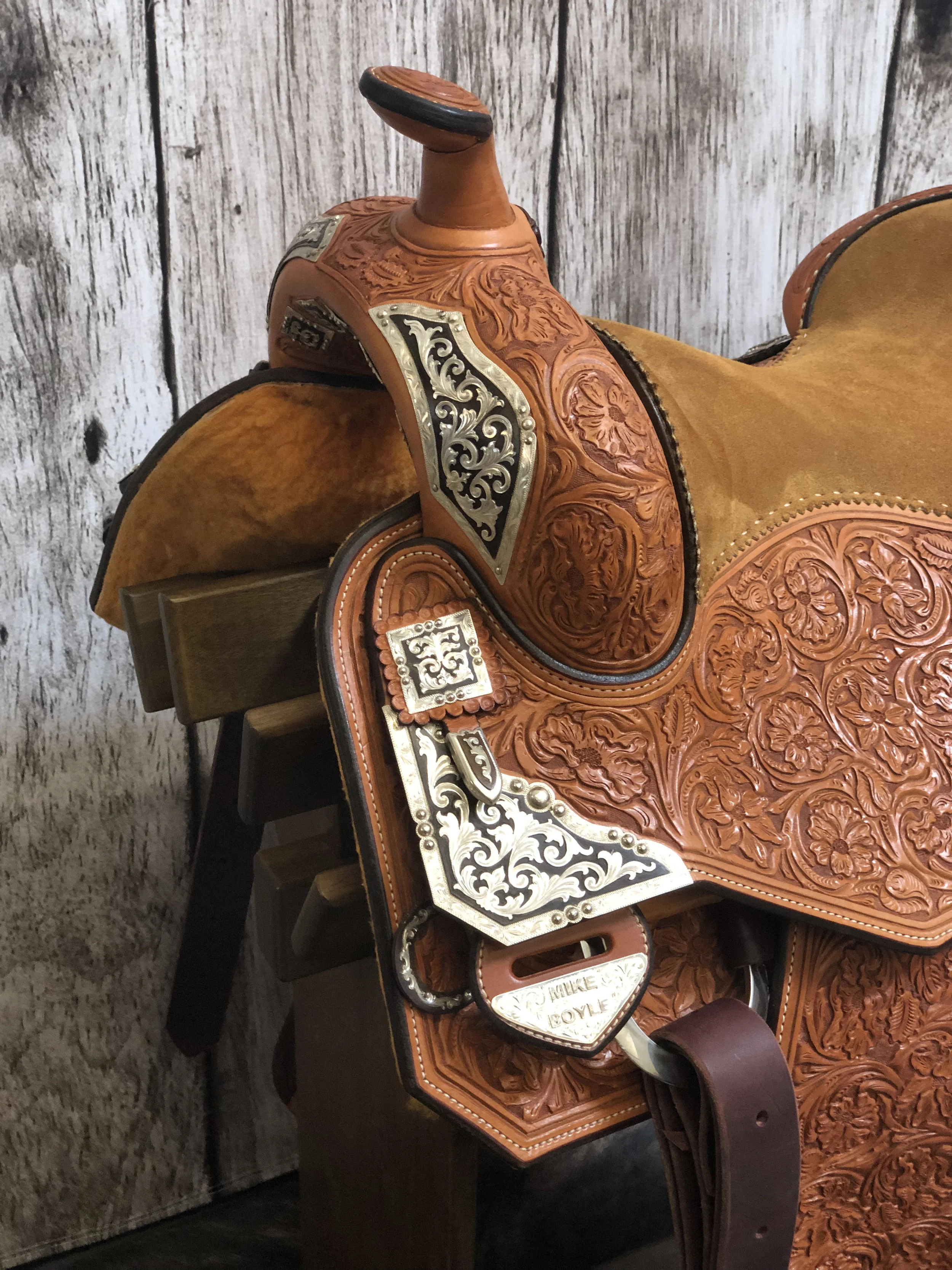 Brown iron and silver front DH plates crafted for custom western saddles.