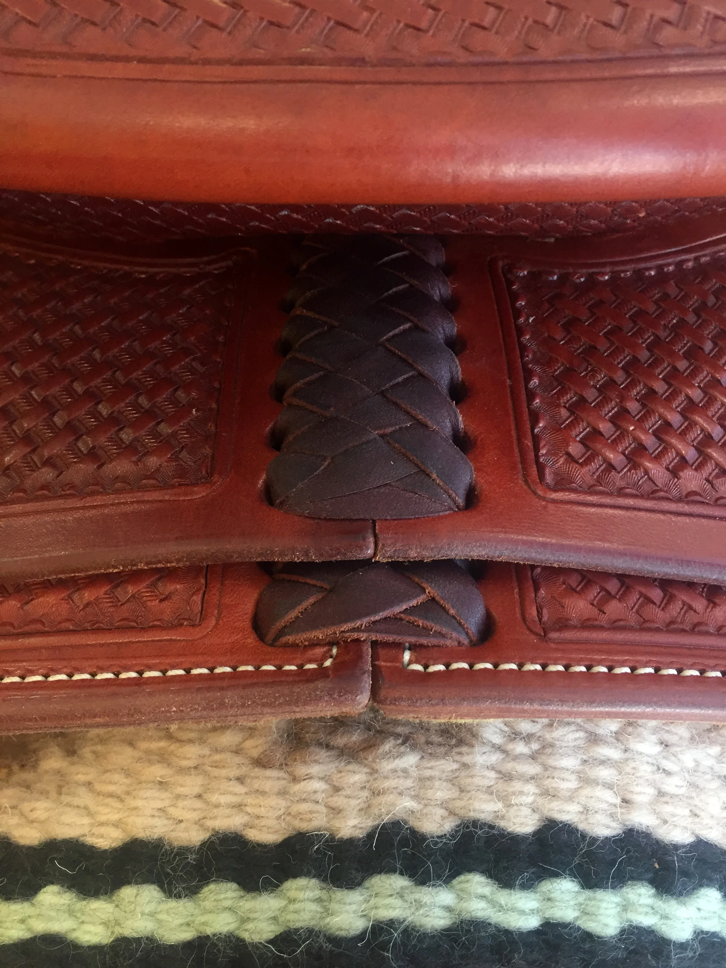 Decorative laced housing crafted for custom western saddles with premium detailing.