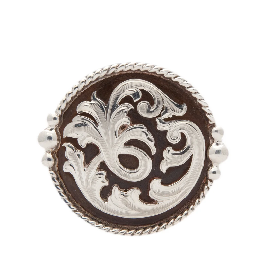 Durango rust iron and silver concho featuring an antique western design for custom saddles.