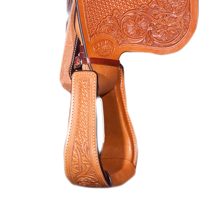 Handcrafted leather stamped Nettles stirrups for custom western saddles.