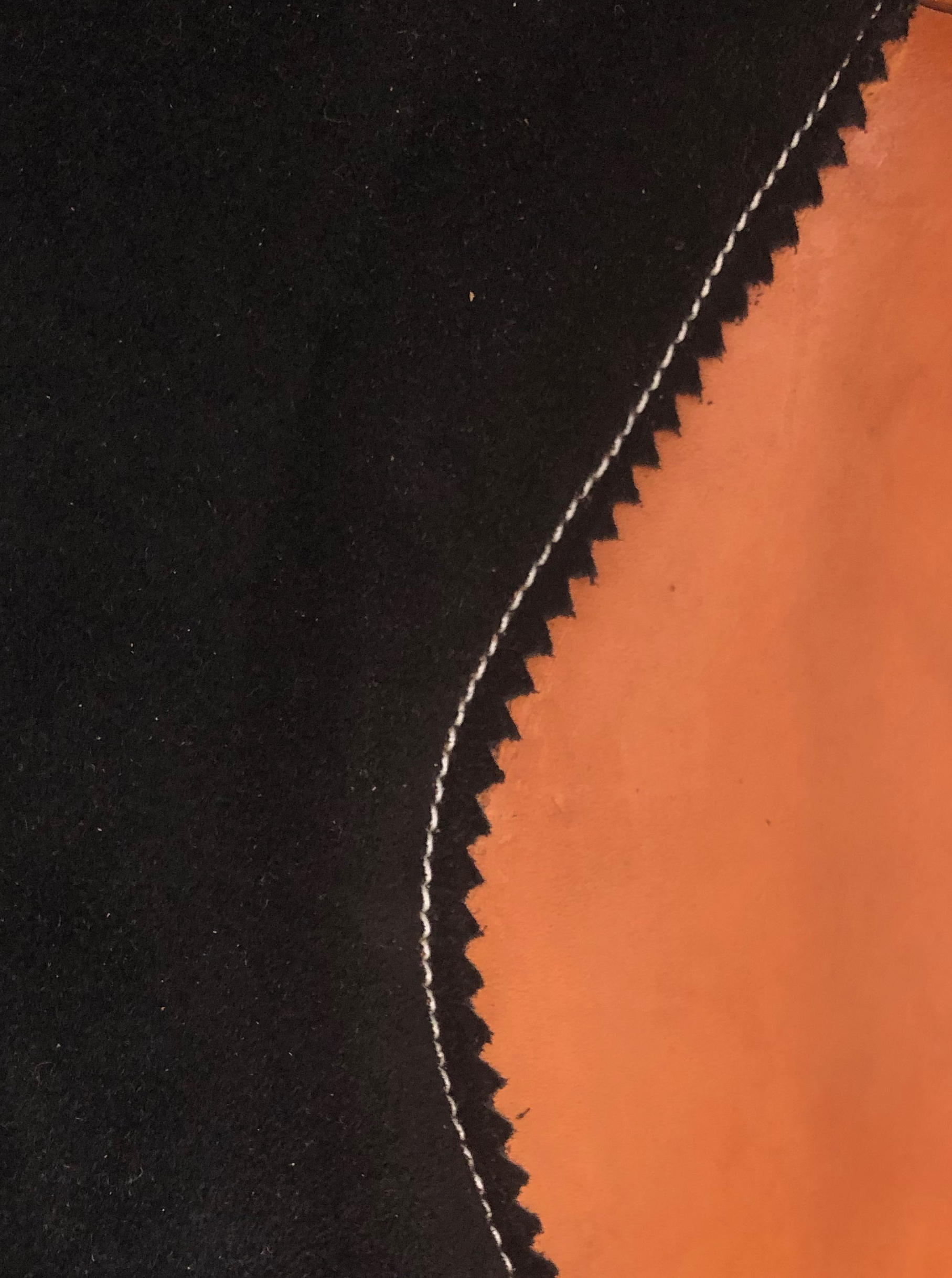 Machine stitched saddle seat with durable construction for western saddles.