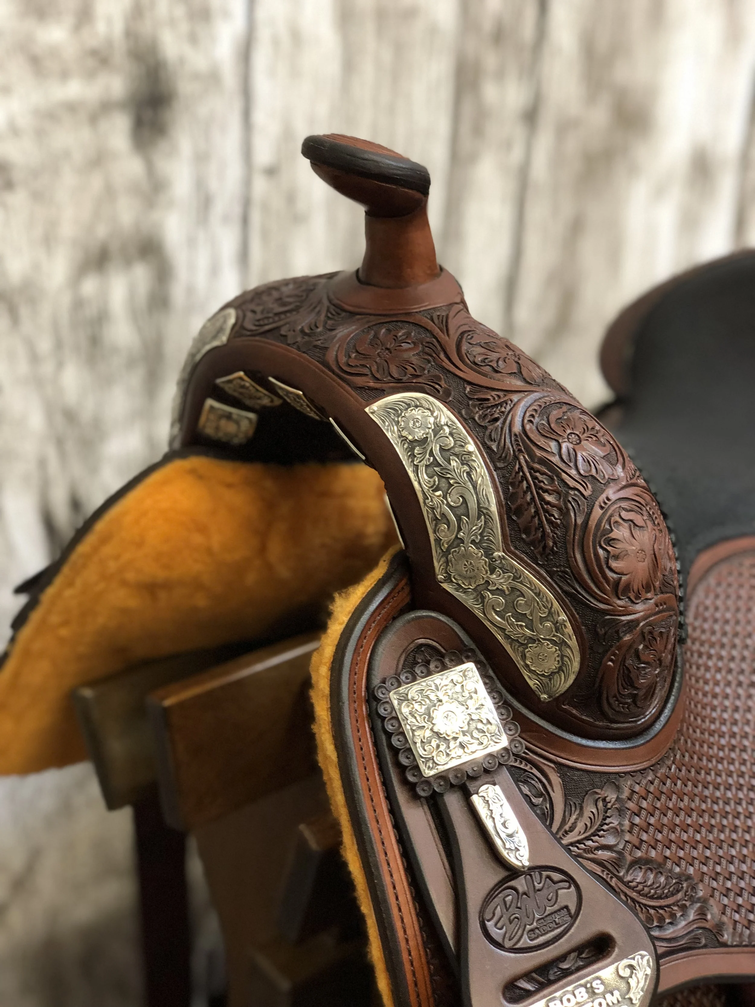 Oxidized silver flower front DH plates crafted for custom western saddle hardware.