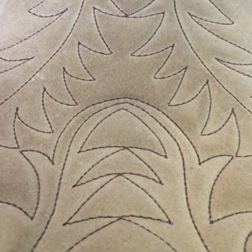 Quilted padded saddle seat upgrade for enhanced western riding comfort.