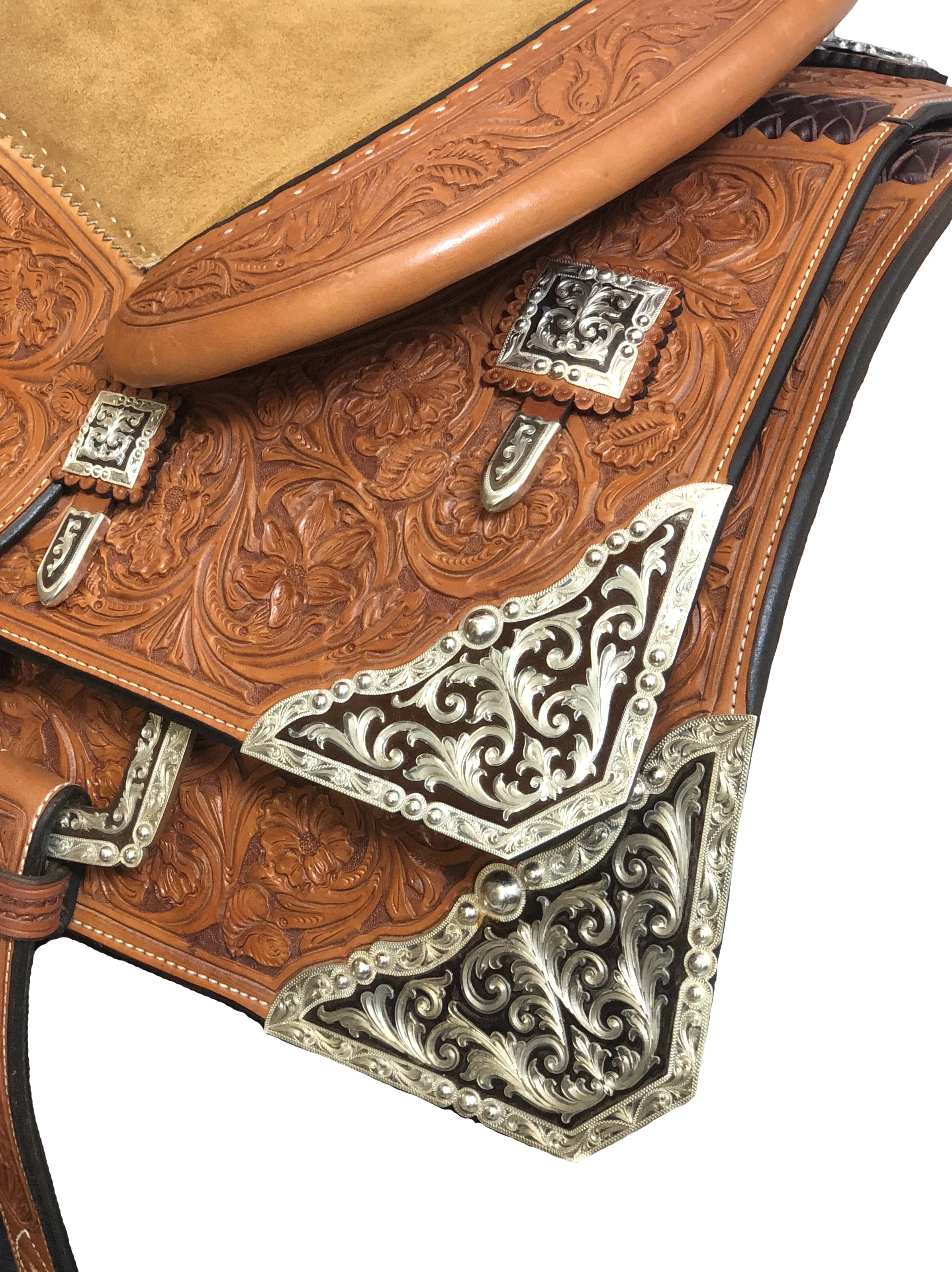 Custom rear skirt corners and housing plates designed for premium western saddles.