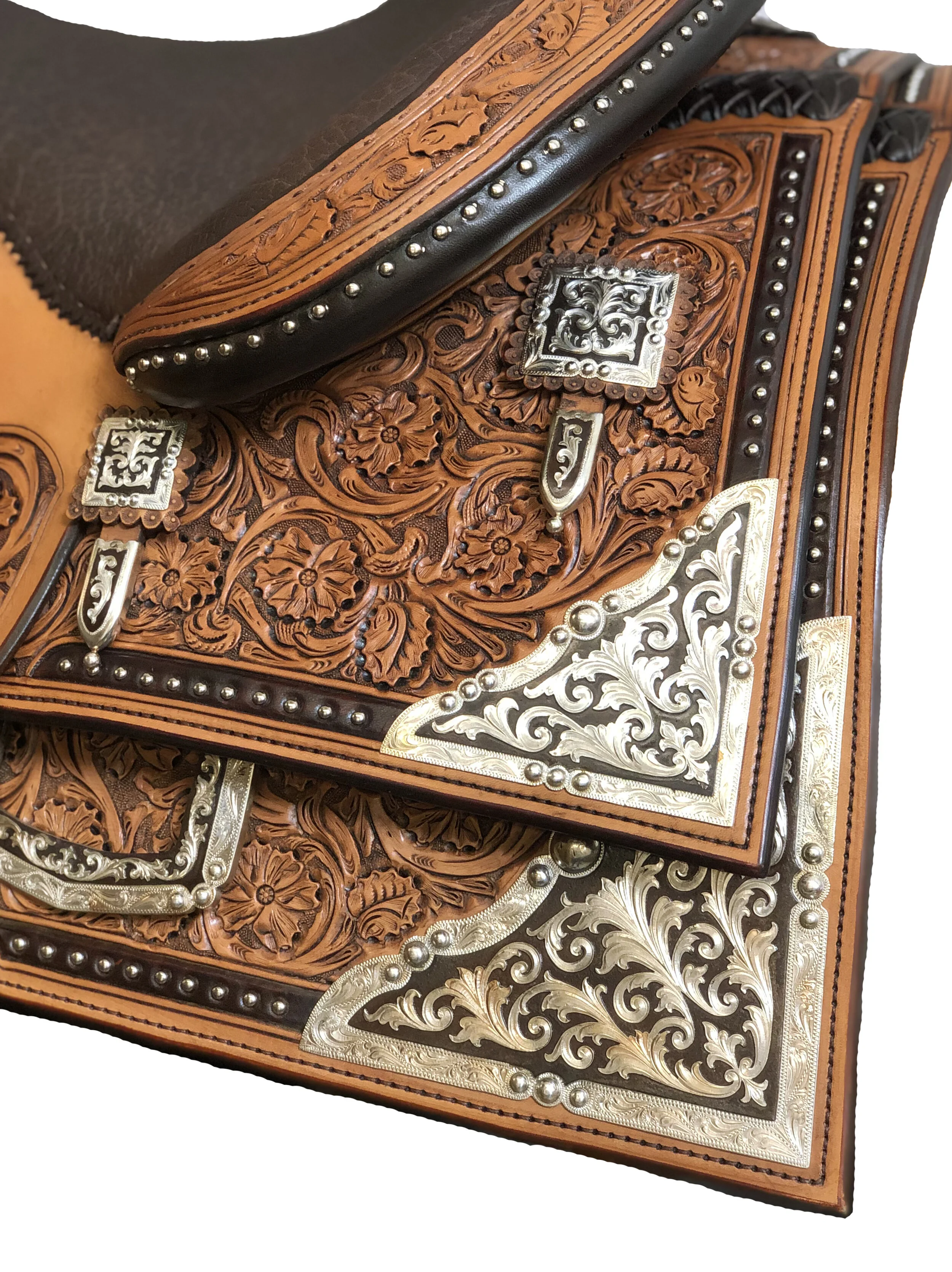 Rear skirt corners and saddle housing plates for custom western saddle upgrades.