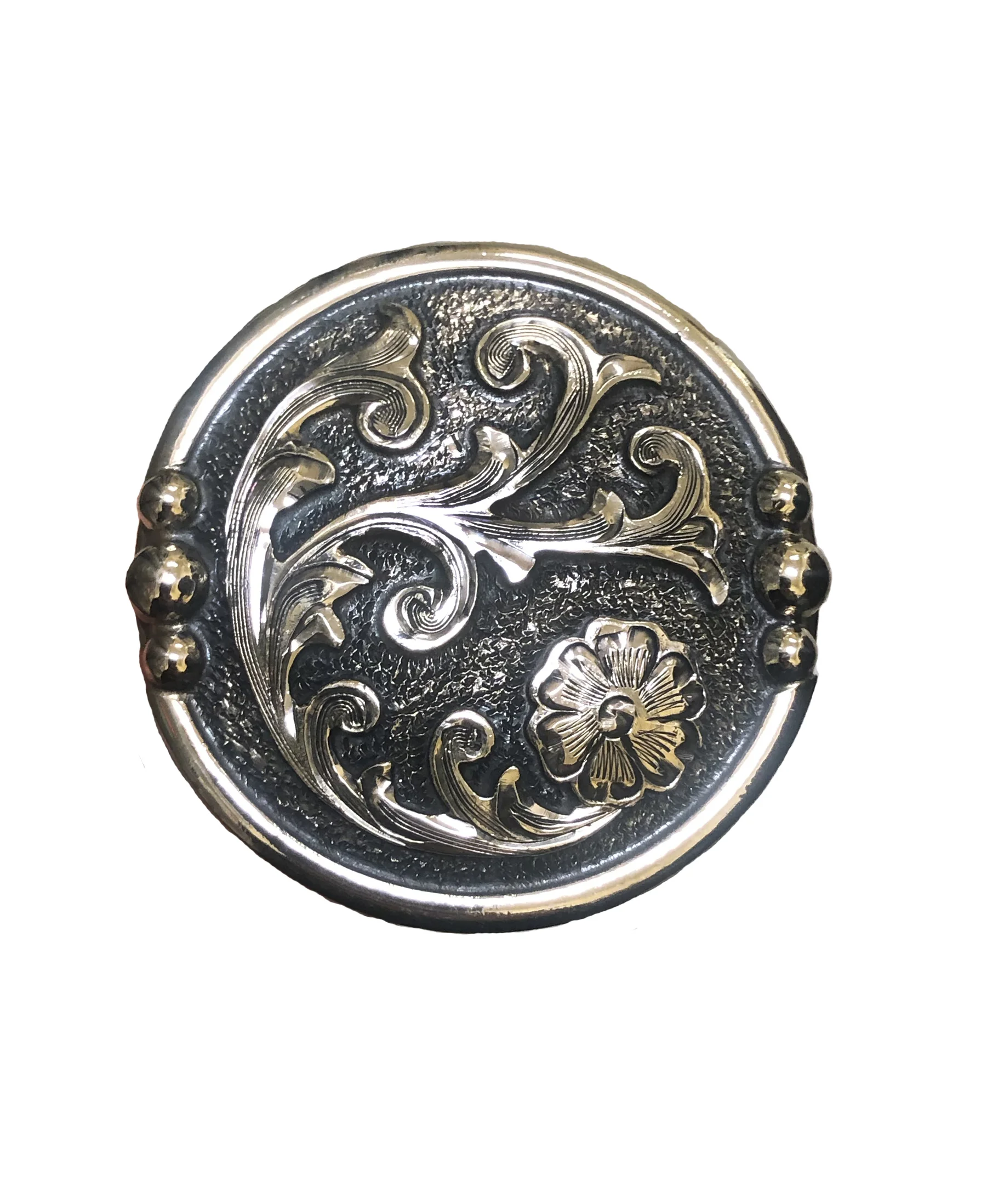Round nickel concho featuring floral western engraving for leatherwork and saddles.