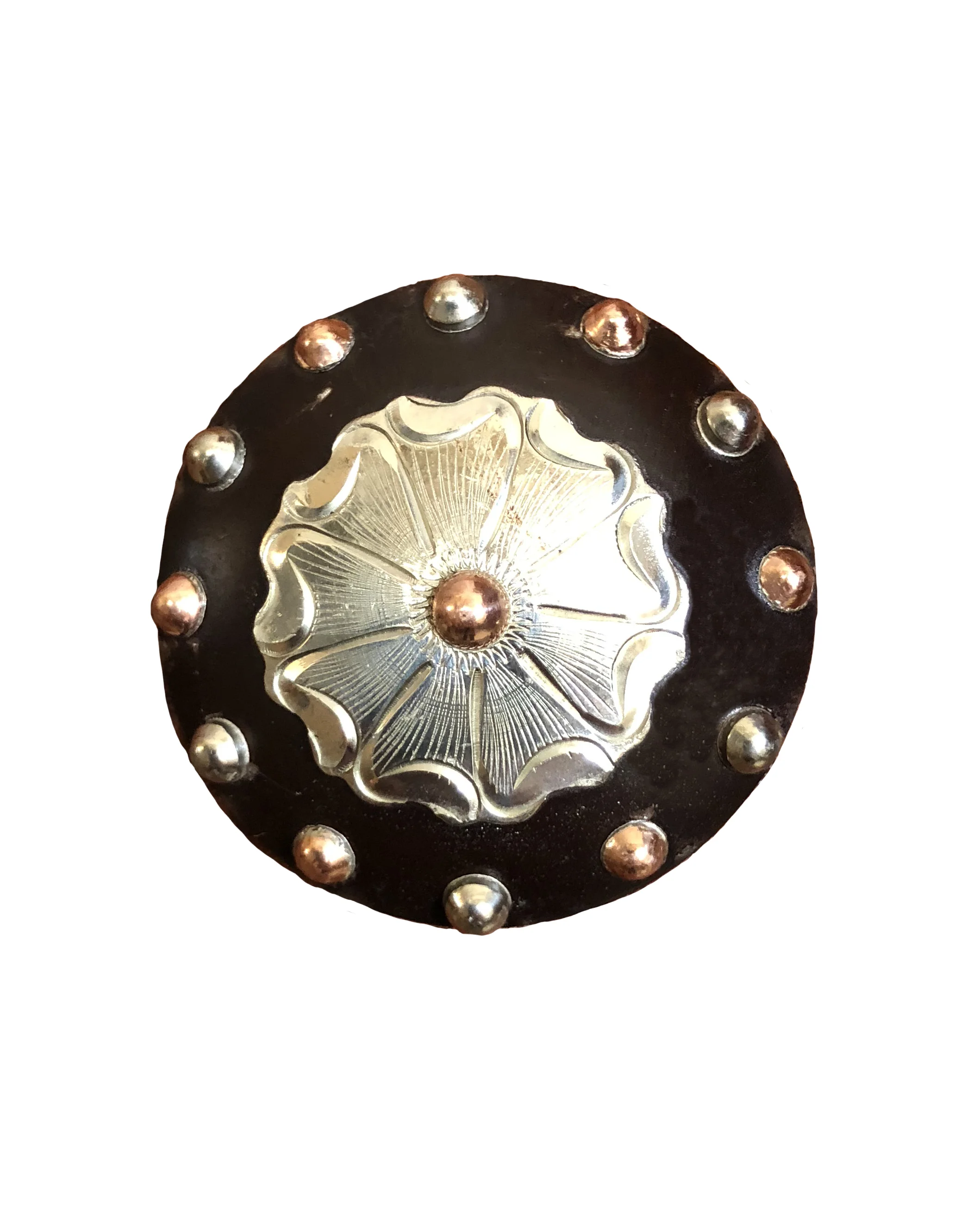 Rust iron concho with silver and copper accents for custom western saddles and tack.