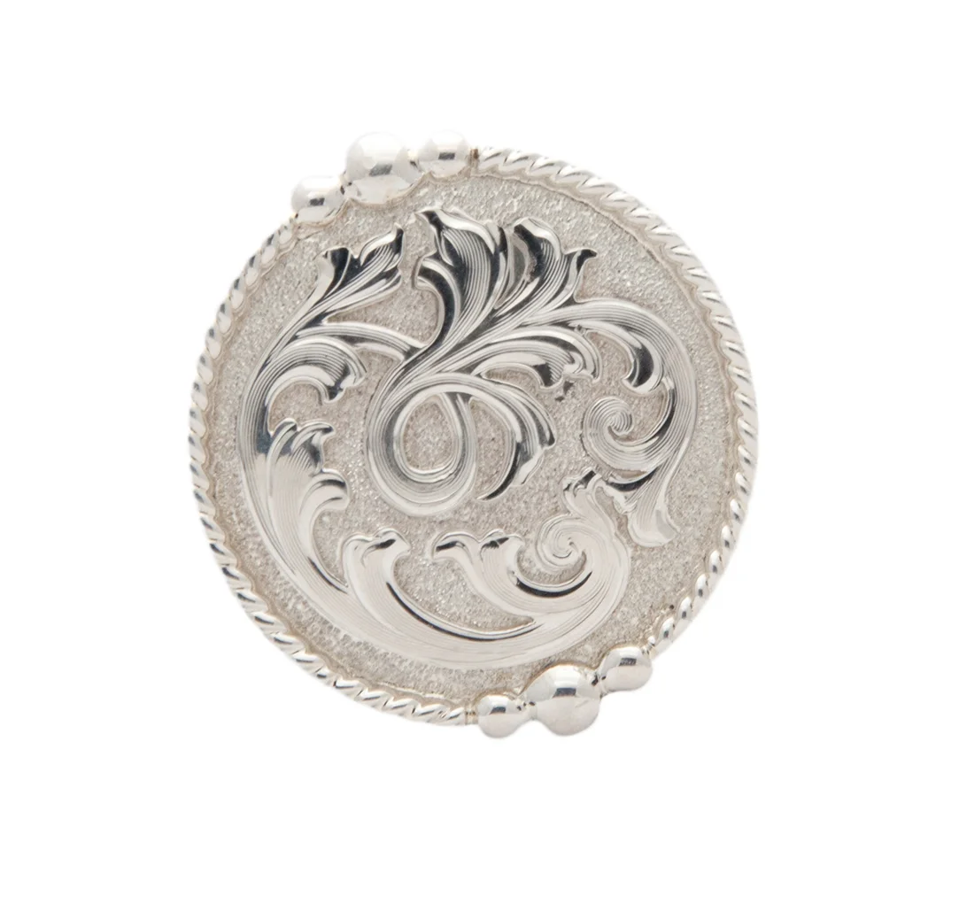 San Miguel silver concho crafted with traditional western styling for saddles and leather gear.