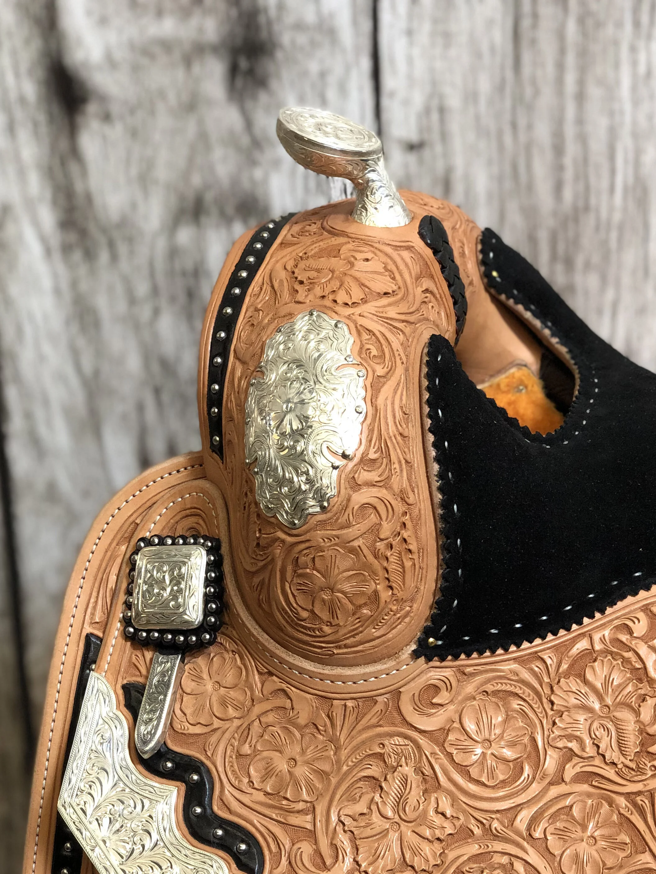 Side-view silver overlay swell plates designed for premium western saddle customization.