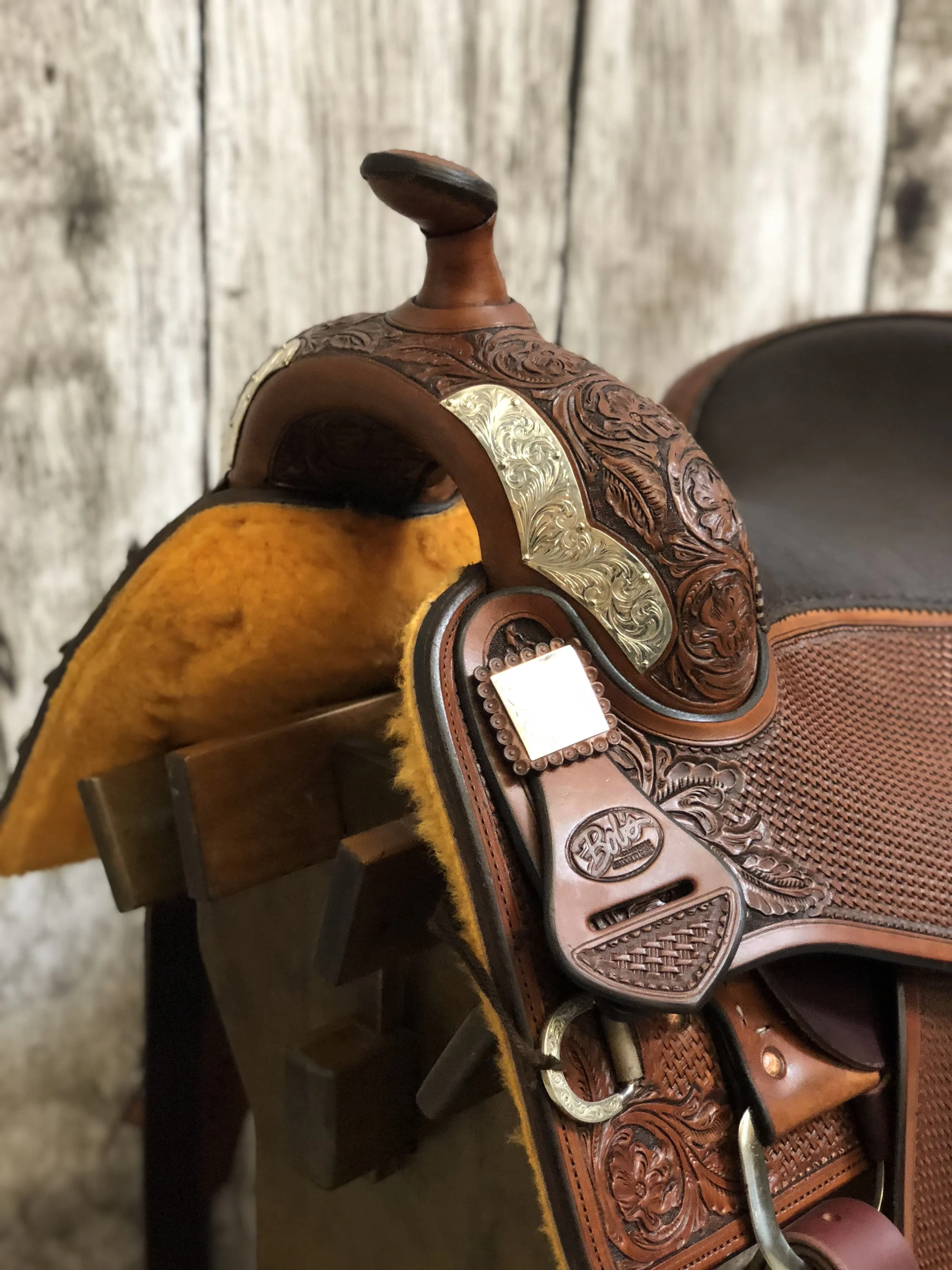 Silver overlay front DH swell plates for premium custom western saddle designs.