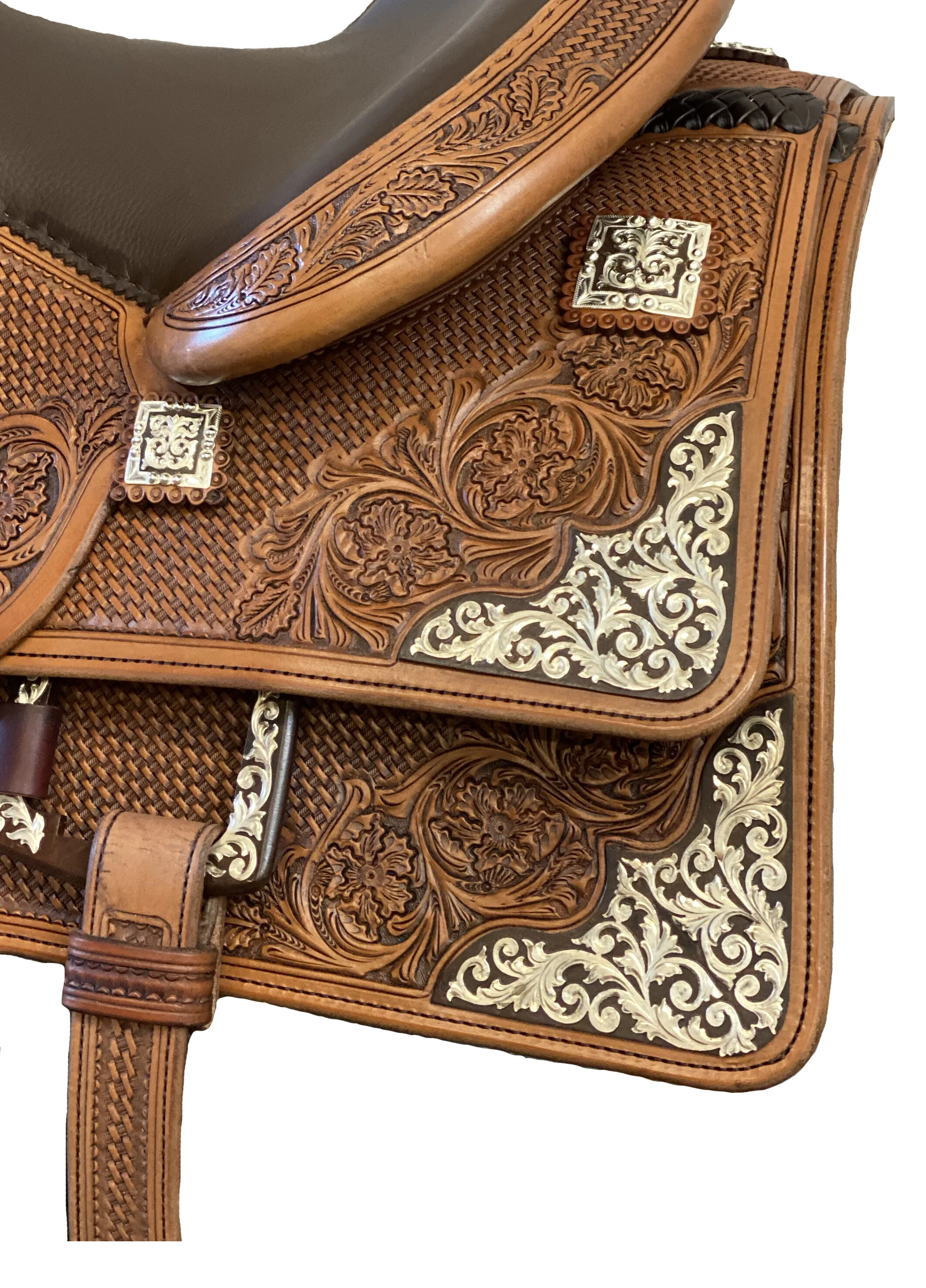 Silver overlay scroll rust iron saddle corner plates for premium western saddles.