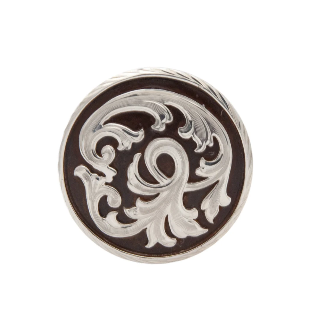 Taos rust iron and silver concho handcrafted with rustic detailing for western leather gear.